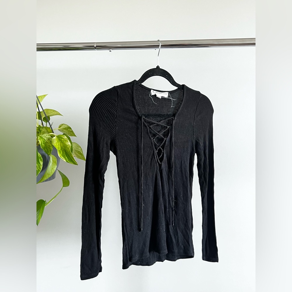 Black long sleeve strappy neck detail tee.